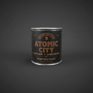 Candle canister labeled 'Atomic City' by Bawston & Tucker 